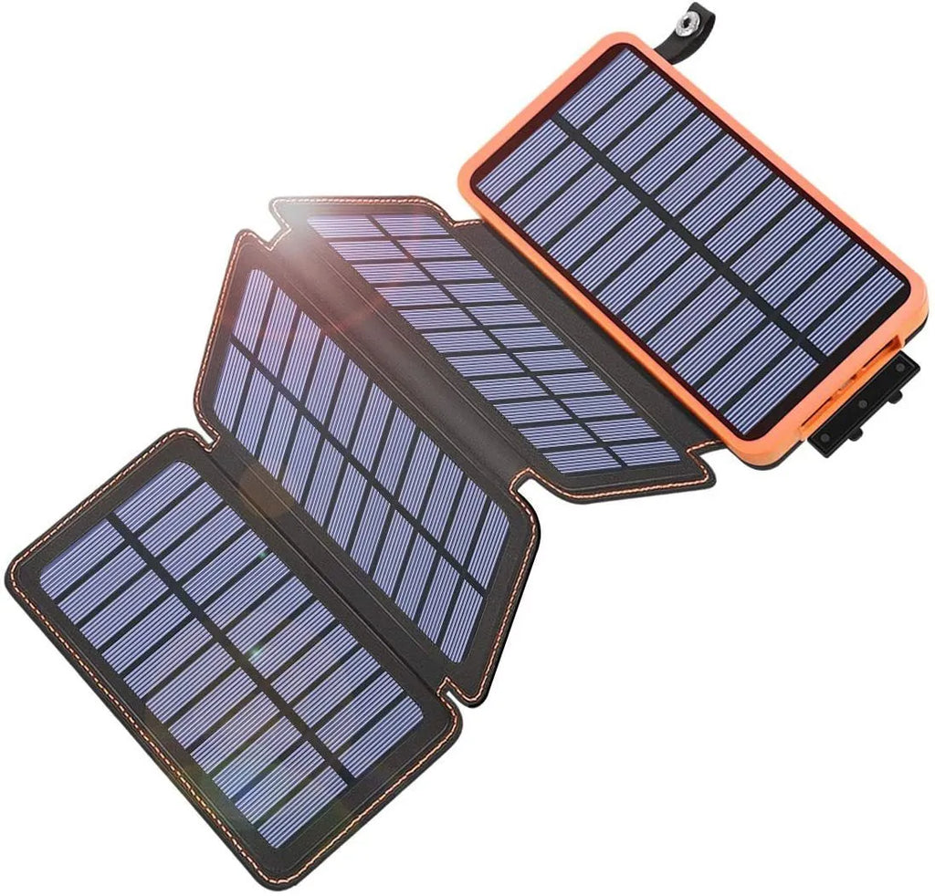 Outdoor solar power bank in black with a solar panel, soft leather finish, and LED light on a grassy field.