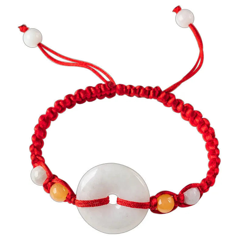 Burmese jade round pendant on an adjustable red rope bracelet with certificate.