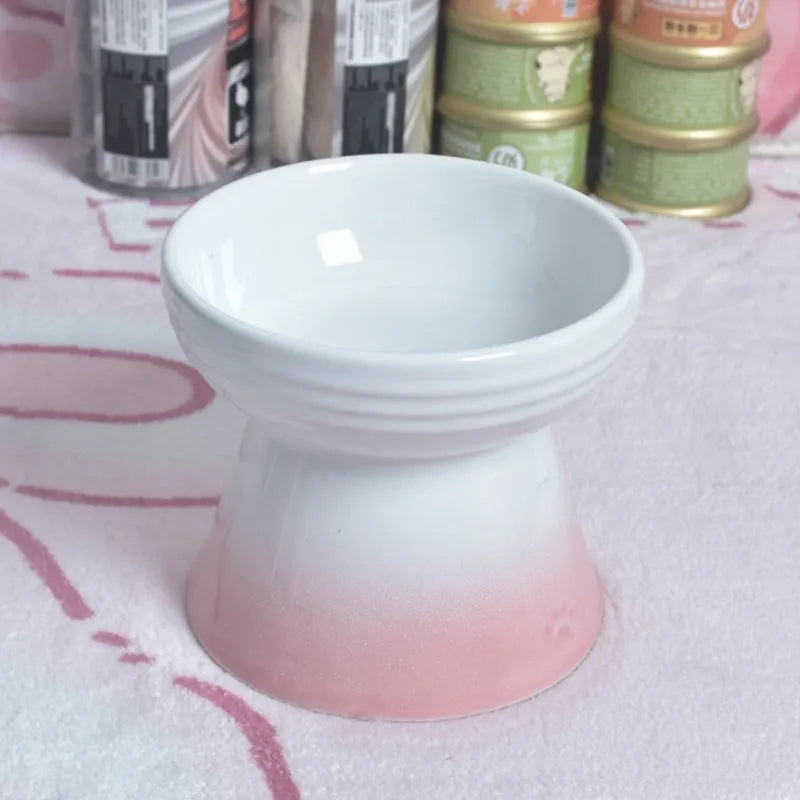 White ceramic pet bowl with a high foot neck and slanted rim for cat or dog feeding
