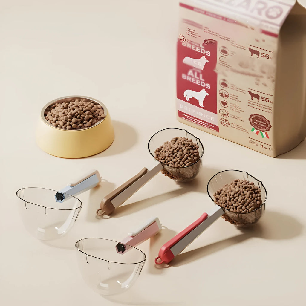 Blue pet food spoon with metal clip attached to a dog food tin.