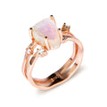S925 silver ring with an irregular triangle-shaped moonstone in a geometric setting, shown in rose gold, white gold, and yellow gold finishes.