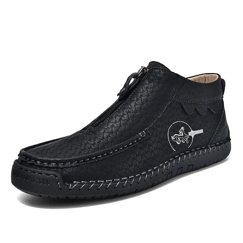 Men's black slip-on leather loafers with round toe and rubber sole, displayed on a white background.