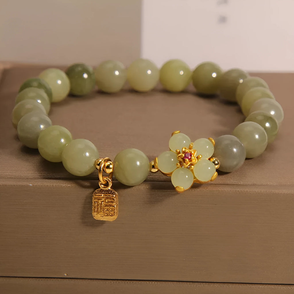 Women's casual fashion bracelet in a grey jade colour with alloy metal construction.
