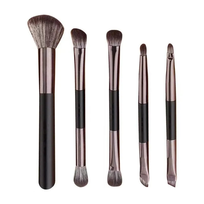 Silver and gold makeup brush sets in a case with a mirror, showing artificial fibre bristles.