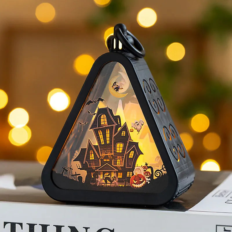 Halloween pumpkin lantern decoration in four colour designs on a table.