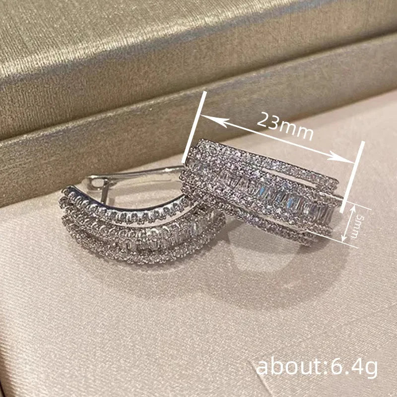 Women's geometry-shaped stud earrings with zircon detailing in white gold colour