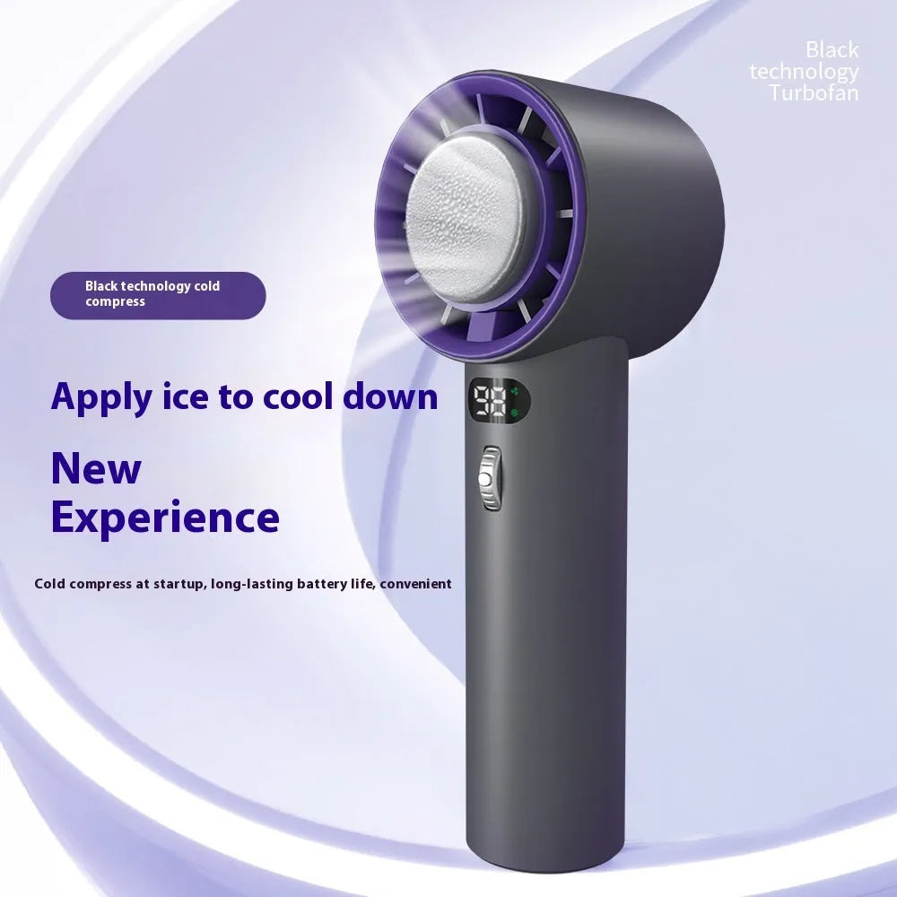 White portable handheld turbo fan with cooling function and display, shown on a table.