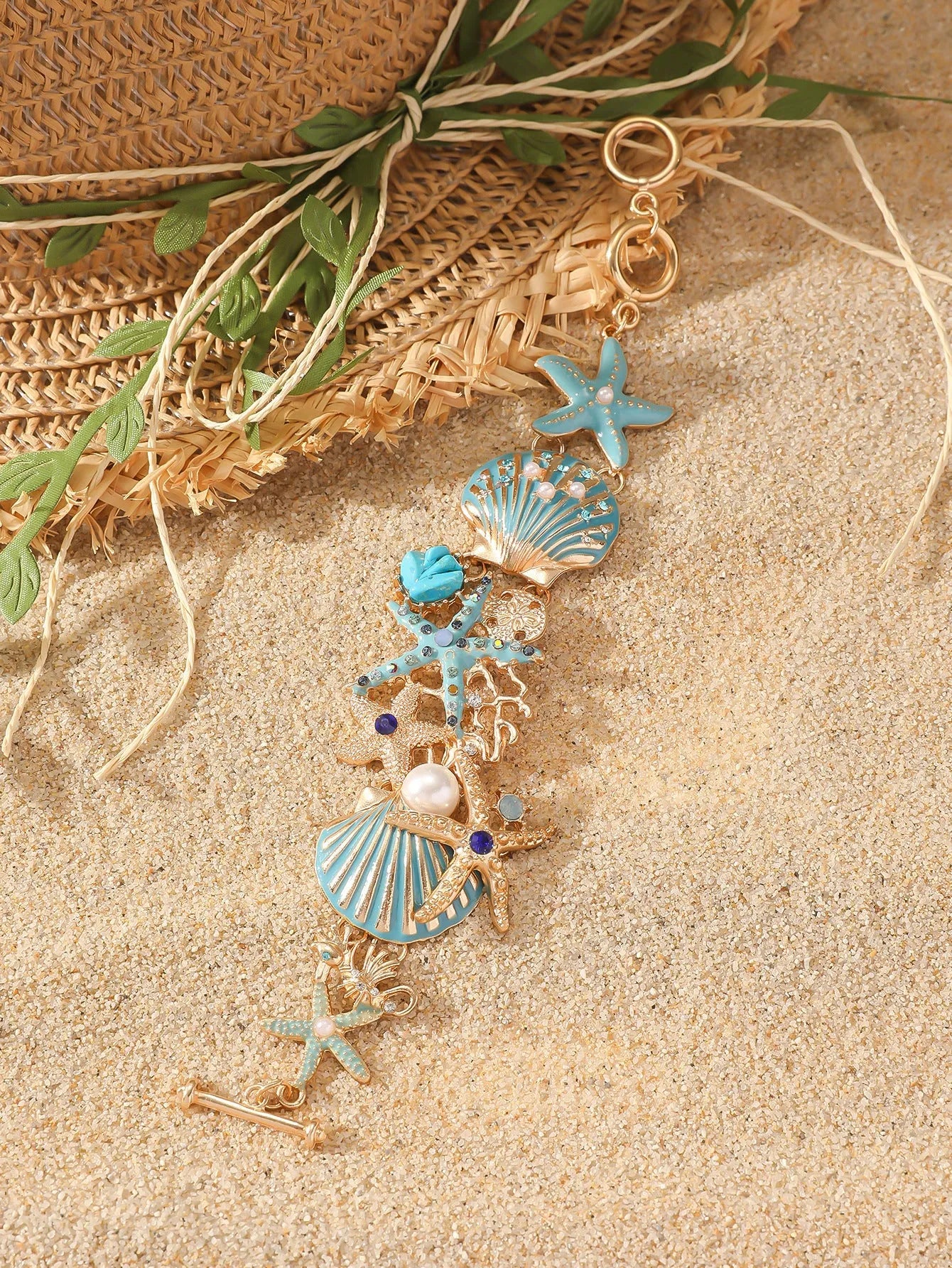 Alloy boat anchor and starfish rhinestone bracelet for women in turquoise, coral red, or coral blue.