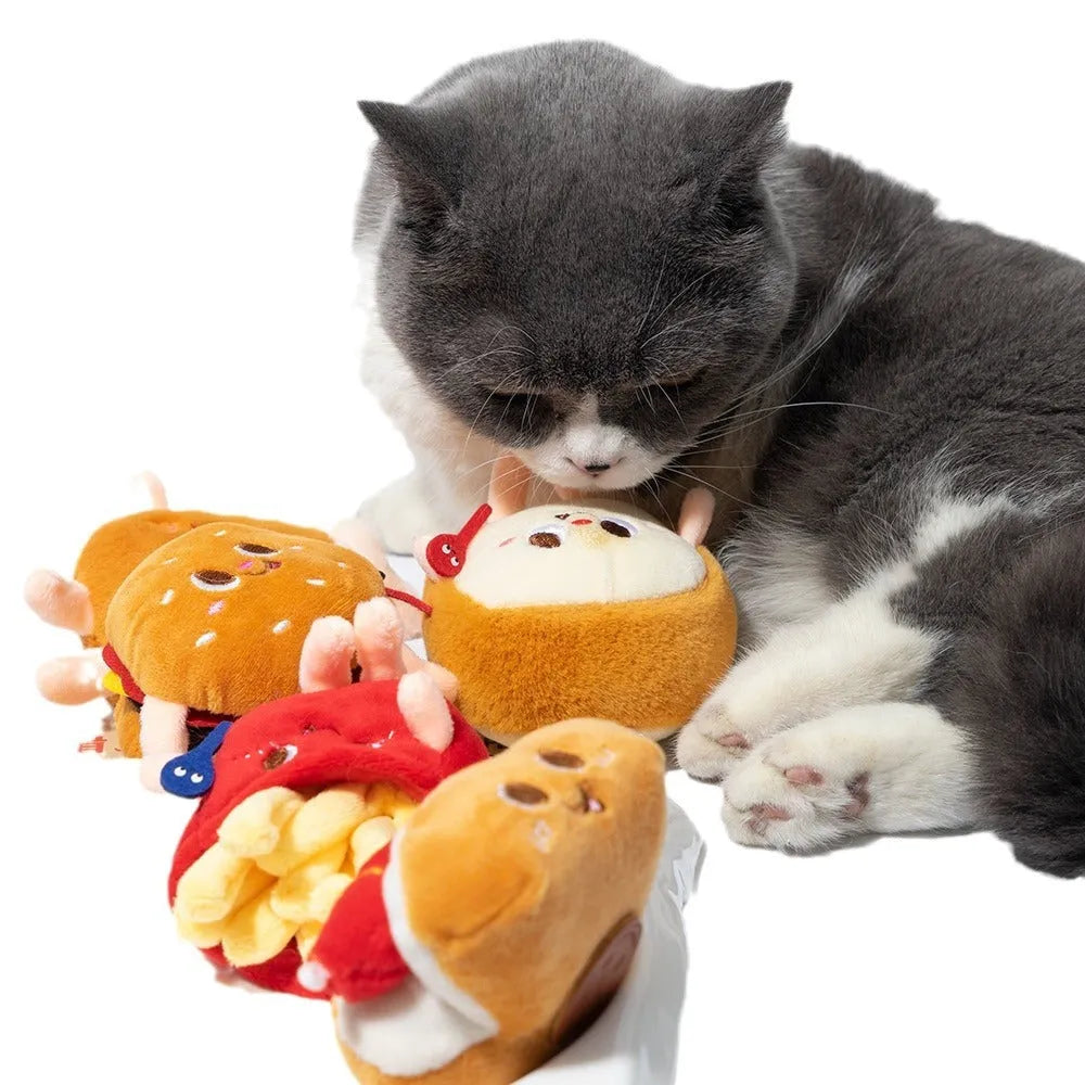 Cat chewing toy shaped like hamburger and chicken leg with catnip filling