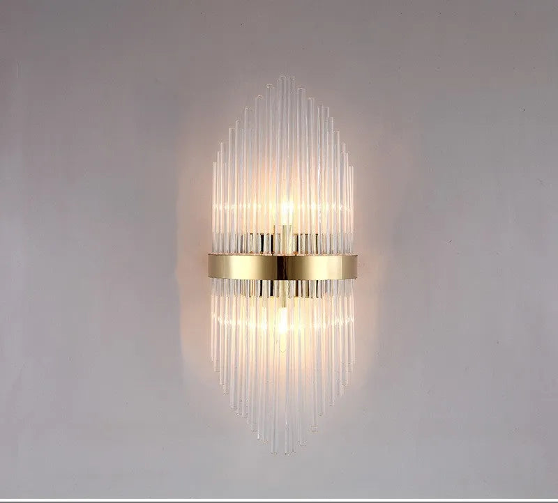 Modern crystal wall lamp with petal design and titanium gold finish mounted on wall