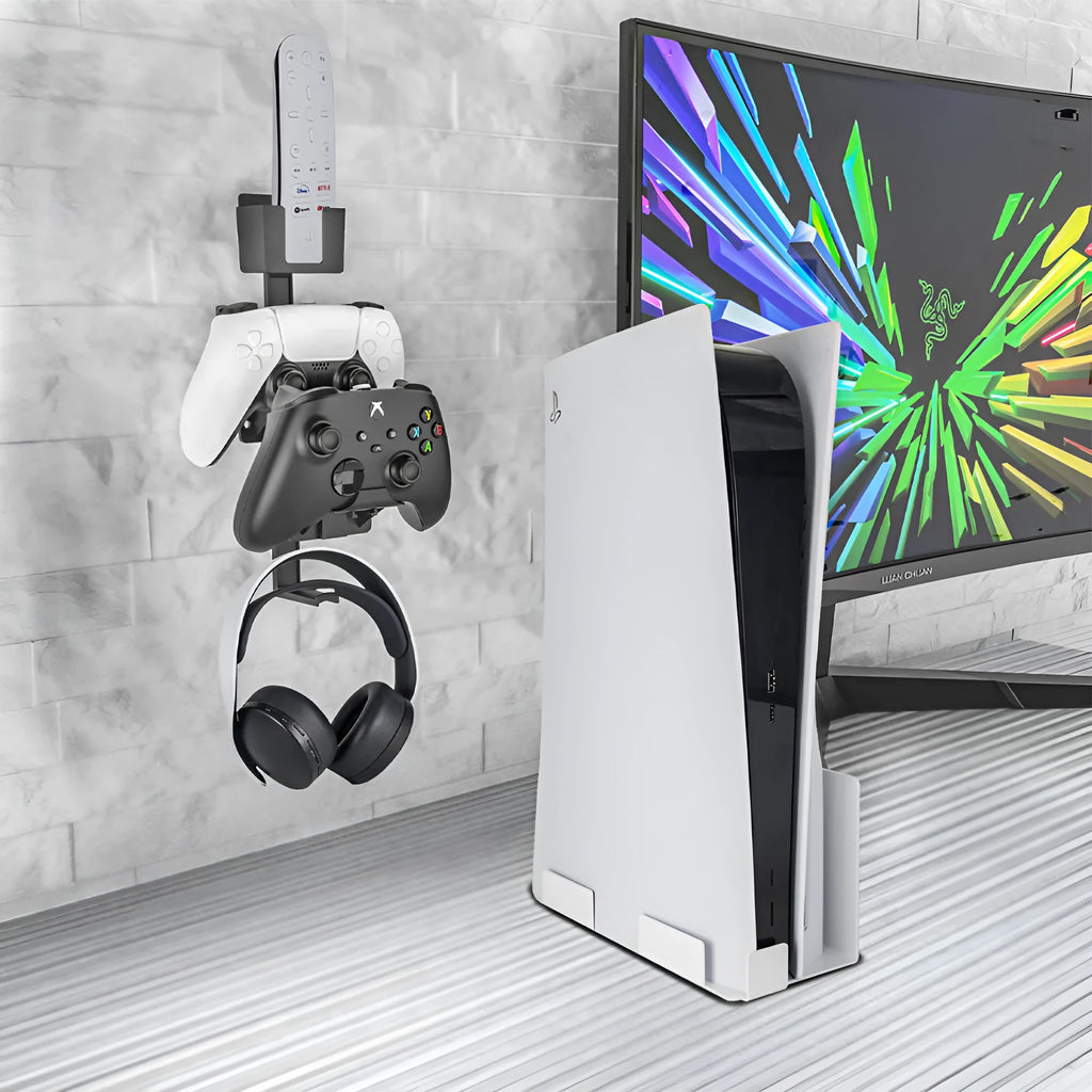 White wall-mounted storage hook holding PS5 controller and headphones