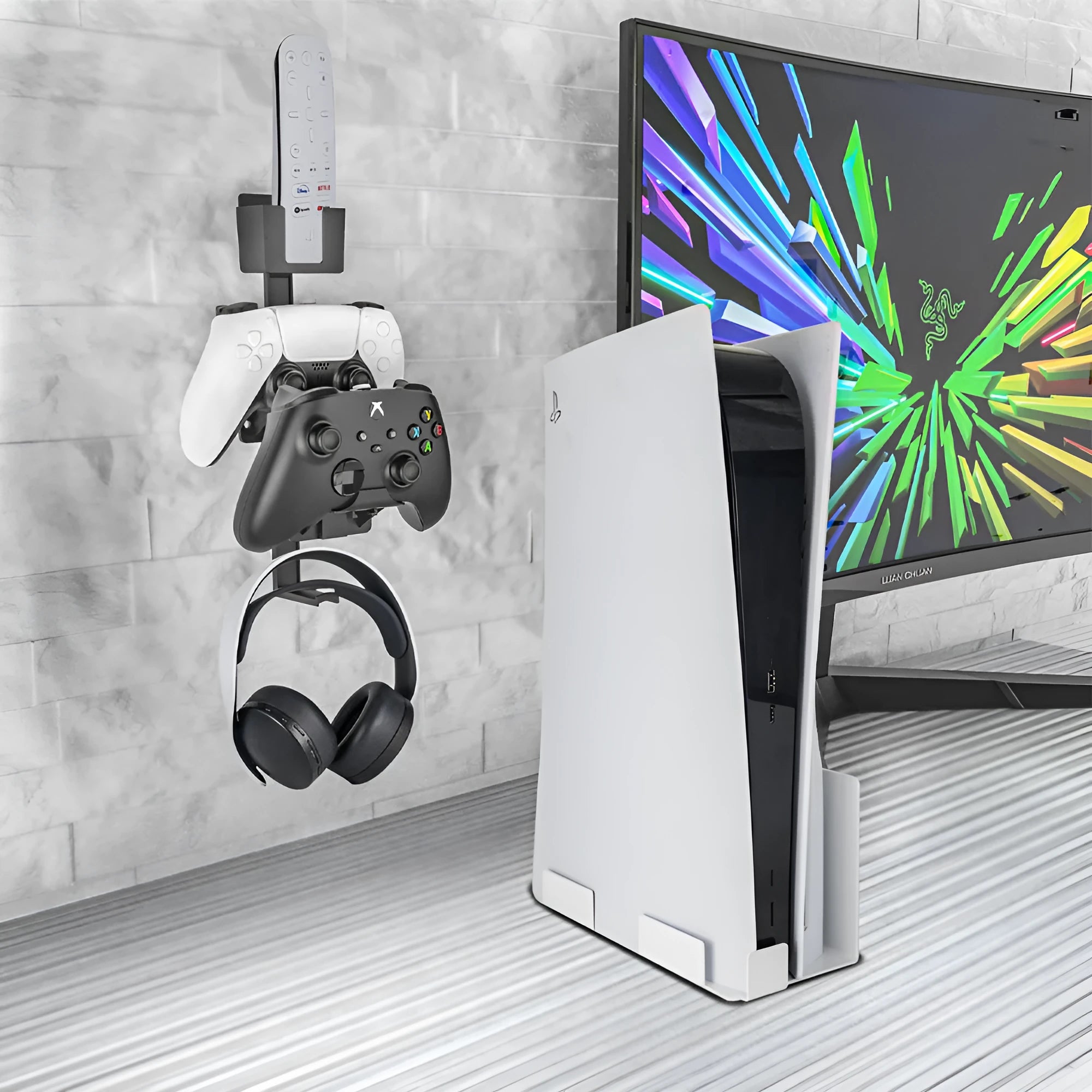 White wall-mounted storage hook holding PS5 controller and headphones