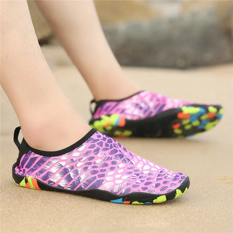Blue Lycra beach wading shoes with EVA sole for men and women, shown on a sandy background.