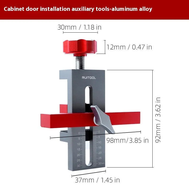 Aluminium alloy cabinet door installation aid tool for woodworking projects on a workbench.