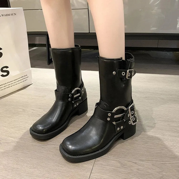 Women's black platform boots with buckle detail at calf length