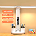 White multifunction LED desk lamp with pen holder, calendar display, and touch controls on a desk