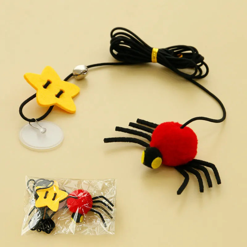Red or yellow cat toy hanging from door with elastic rope, feathers, bells and spider attachment