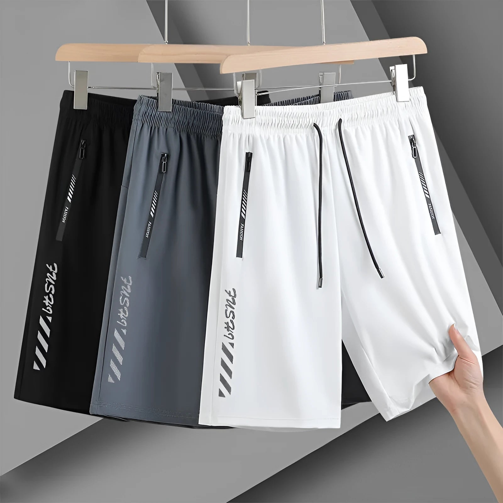 Men's black quick-dry loose-fit nylon sports shorts on a size chart background