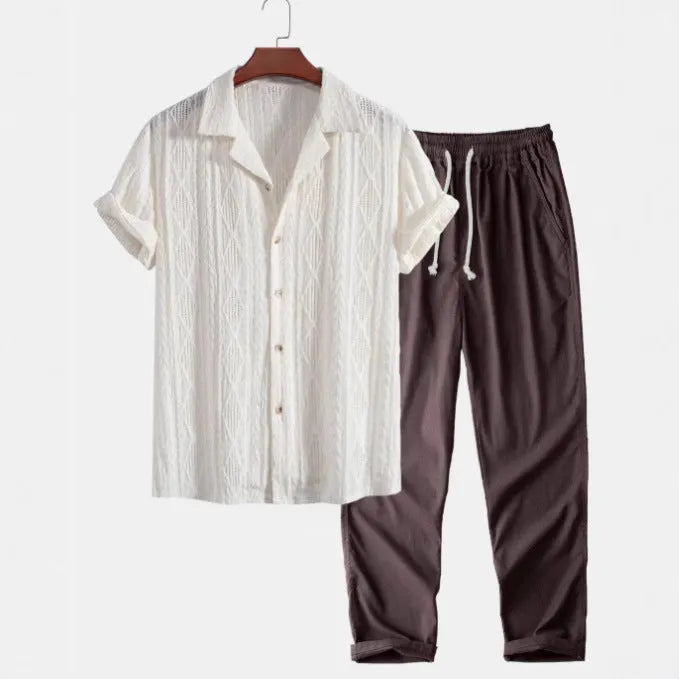 Lightweight linen-feel casual suit set with camouflage print trousers and a short-sleeved lapel shirt.
