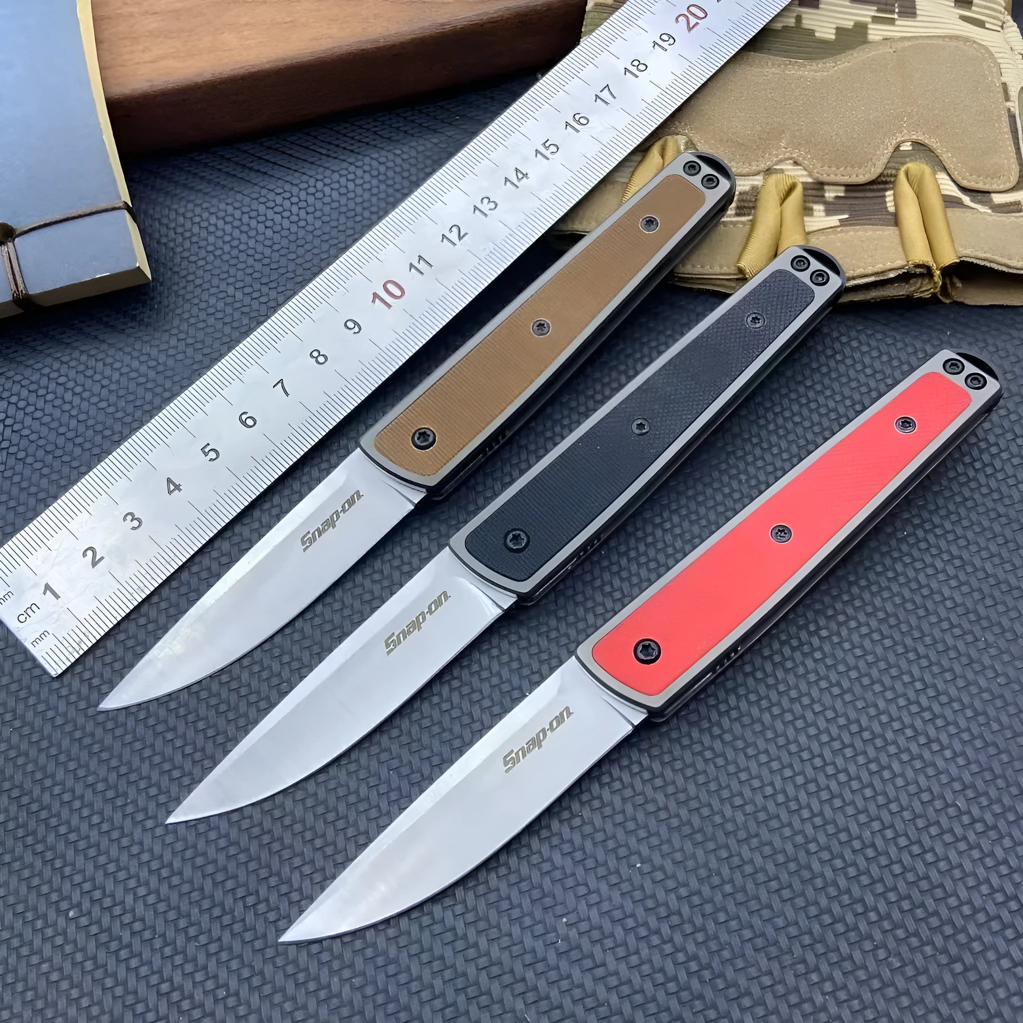 Folding fruit knife with stainless steel blade in black, brown, or red colour options showing 17cm length
