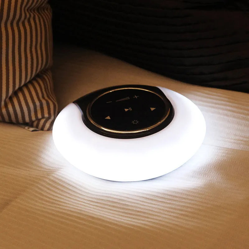 Blue Bluetooth desk lamp speaker with touch controls showing white, yellow and blue light options