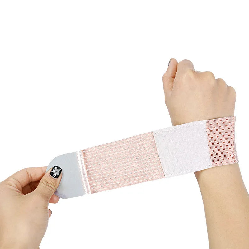 Athletic wristguards in black, gray, and pink colours showing elastic breathable fabric construction