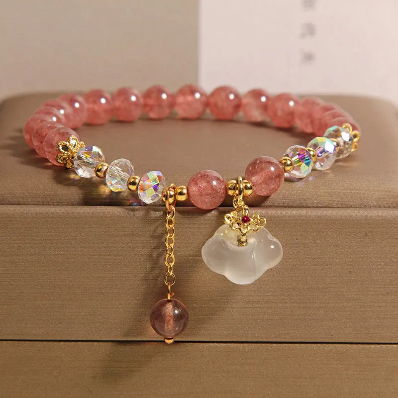 Women's adjustable crystal bracelet with strawberry quartz and white agate beads featuring auspicious cloud charm