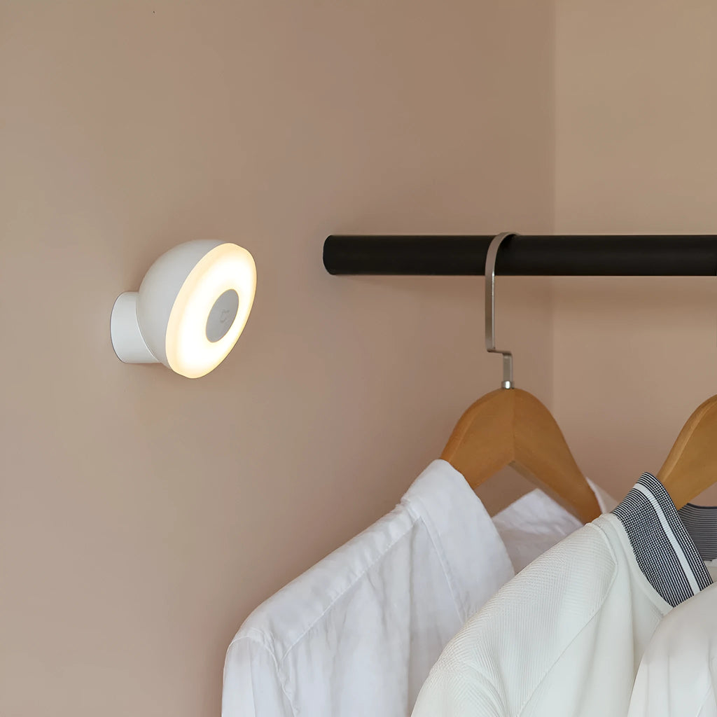 White modern bedside table lamp with human body induction and Bluetooth, shown on a nightstand.