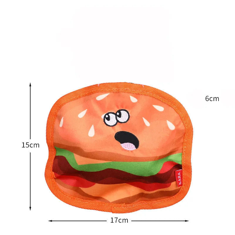Colourful crinkle and squeak dog toy in a fast-food burger shape on a white background.