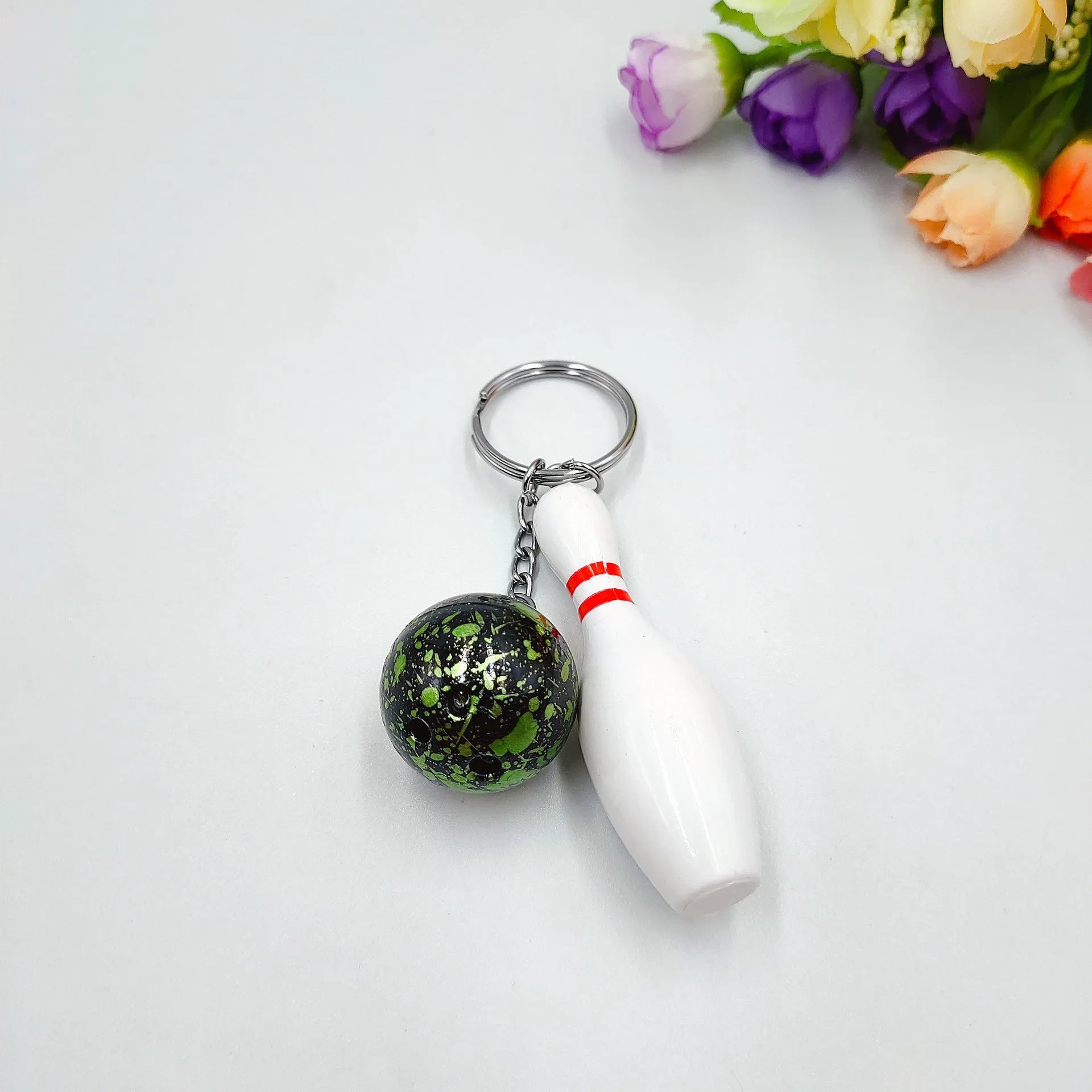 Miniature bowling alley simulation keychain pendant in blue colour with metal key ring