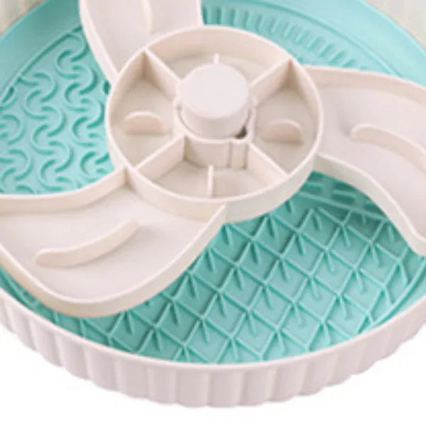 Colourful rotating pet slow feeder bowl with a silicone licking mat in a windmill design.