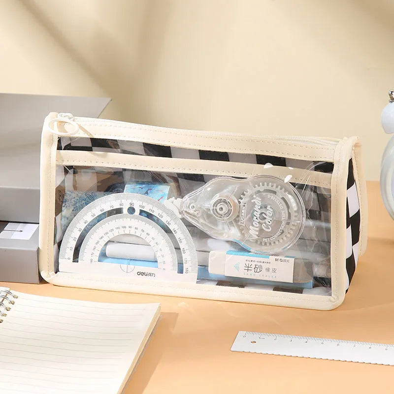 Clear PVC pencil case with black and white chessboard grid design, showing pens inside.