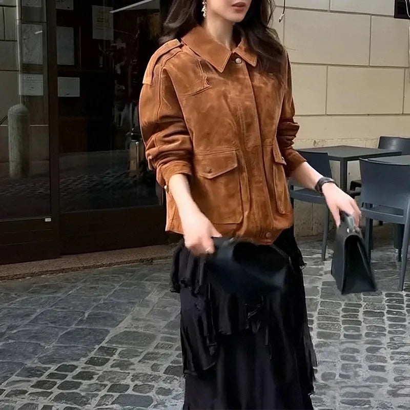 Women's brown suede-look polyester coat with regular sleeves on a hanger.