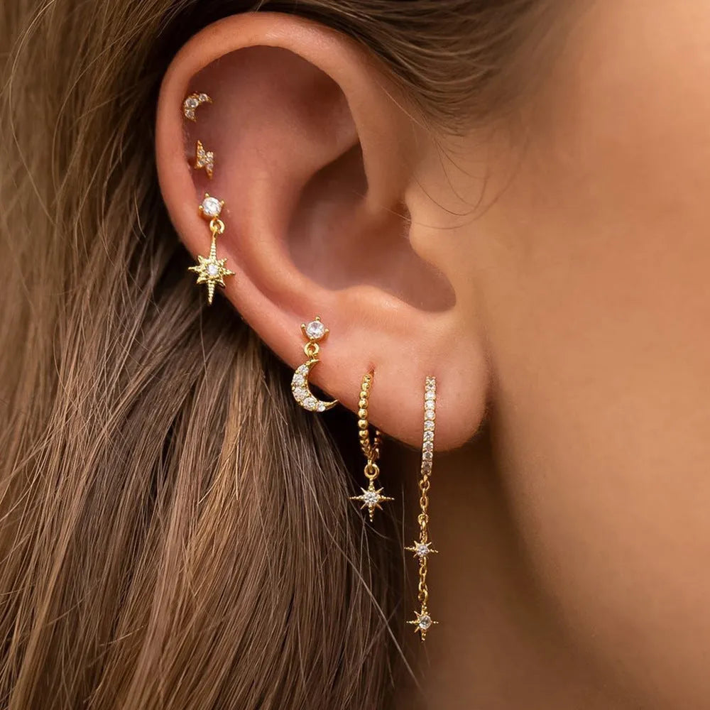 XINGX six-pair gold chain tassel earrings set with zircon studs on jewellery display