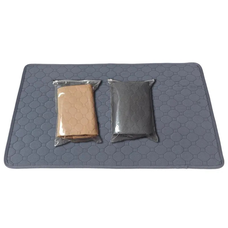 Tan and grey washable dog pee pad on a wooden floor, measuring 18 by 24 inches.