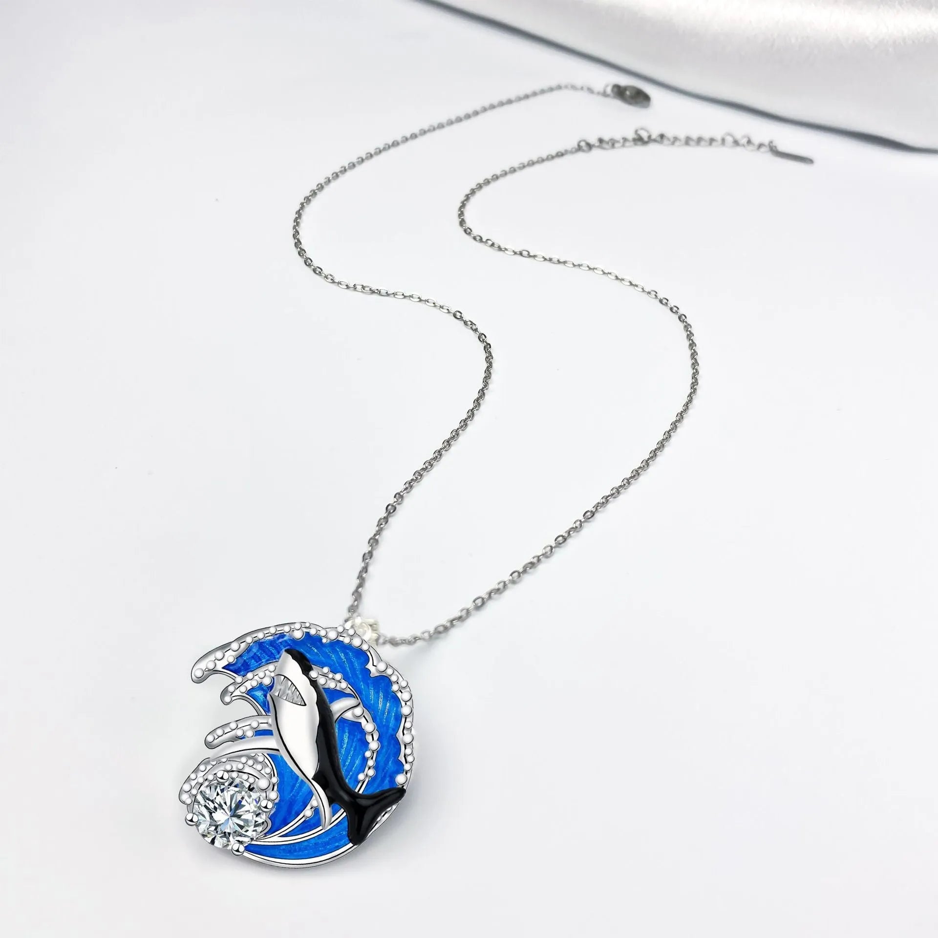 Silver tone shark pendant necklace on cross chain with adjustable 41-50cm length