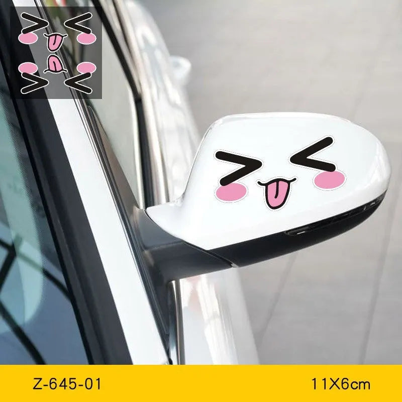 Pair of reflective cartoon car stickers with cute eyes on a car rearview mirror.
