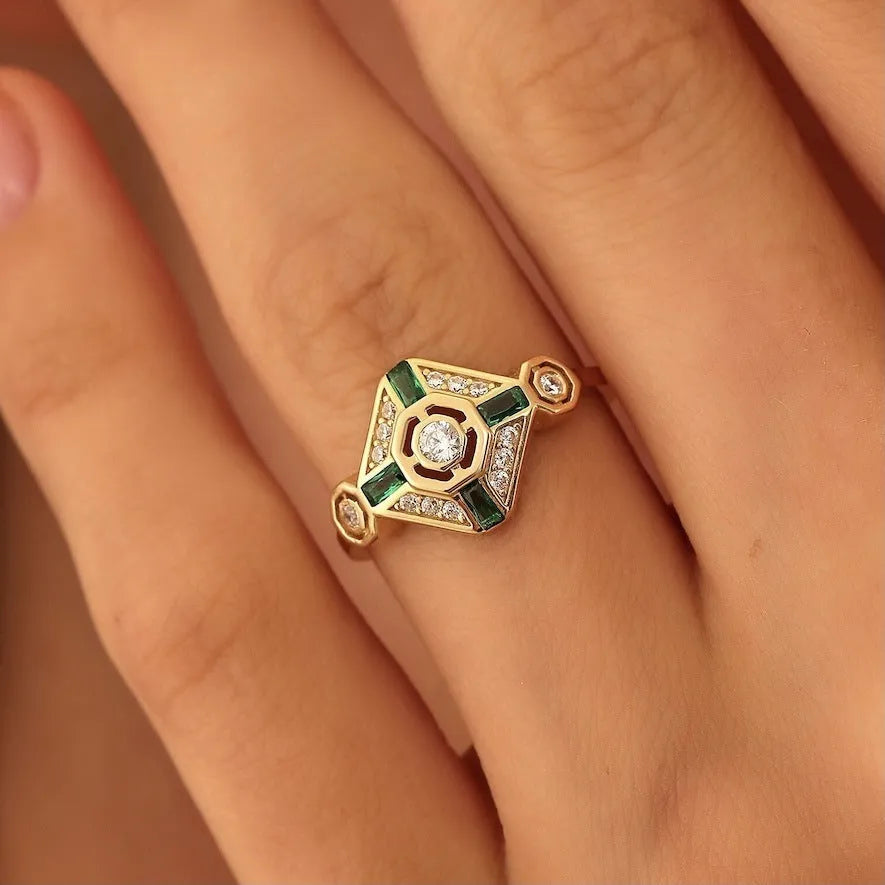 Square cut emerald diamond women's fashion ring with a lvzuan green stone on a silver electroplated band.