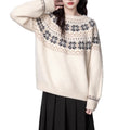 Women's Milky White vintage Fair Isle geometric knit pullover sweater on a hanger.