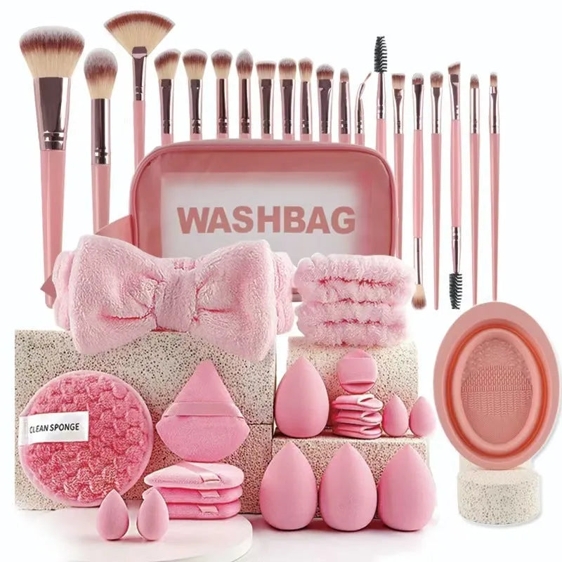 Beauty tool combination set with multiple pieces in brown, pink, and purple colours for face wash and makeup application