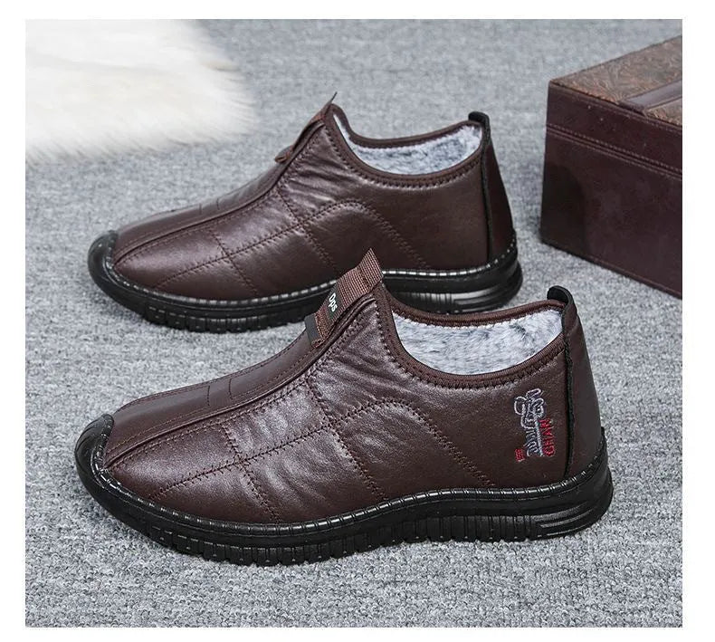 Men's brown buckle-up winter boots with a cotton upper and thick sole on a white background.