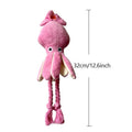 Pink squid-shaped corduroy dog chew toy with a squeaker.