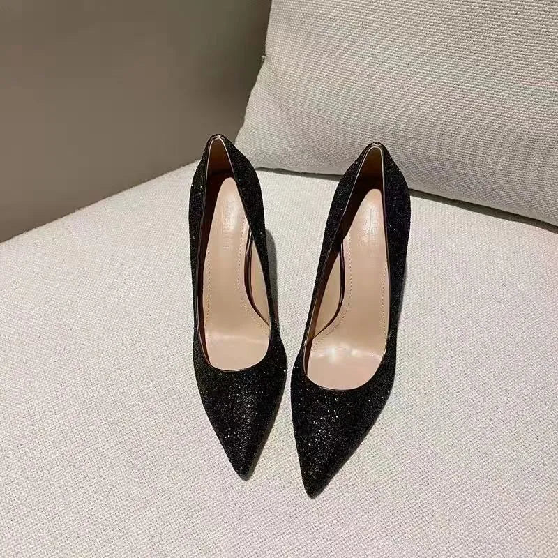 Silver and black women's stiletto wedding shoes with crystal detail on PU leather upper.