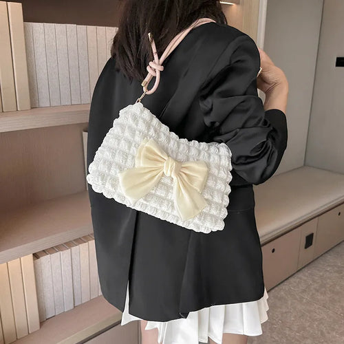 Women's canvas one-shoulder handbag in horizontal square shape with sandwich pocket, shown in black colour