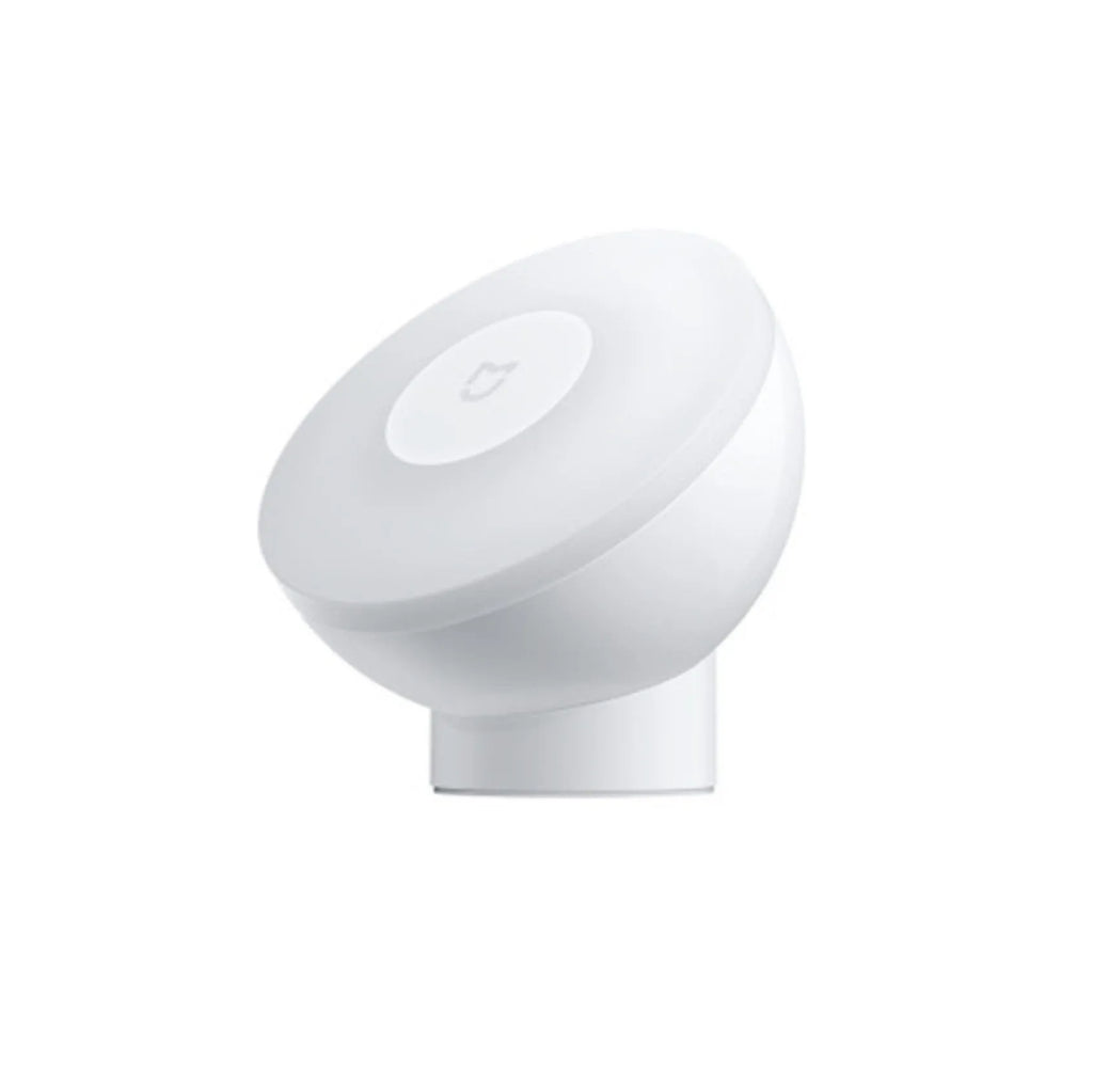 White modern bedside table lamp with human body induction and Bluetooth, shown on a nightstand.