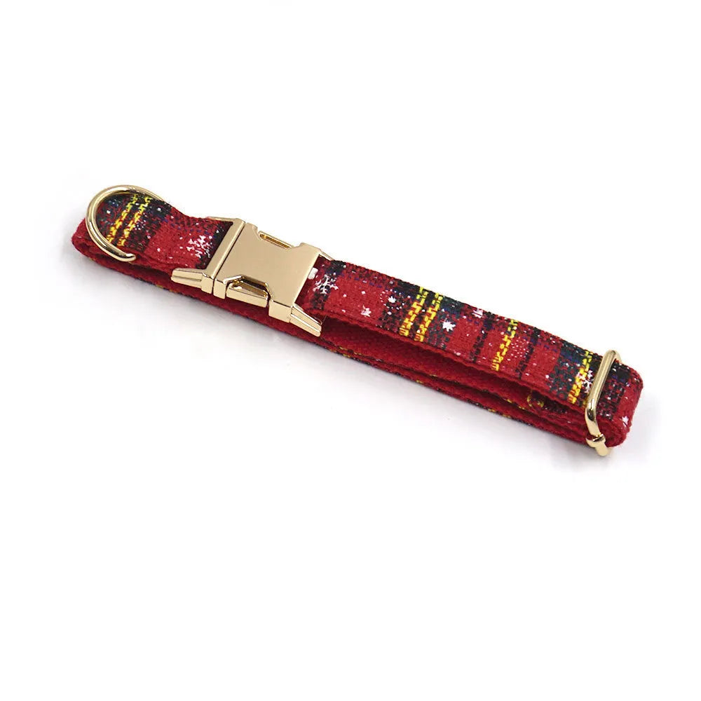 Red Christmas dog suit set with collar, leash, bow, and chest-back harness on a festive background.