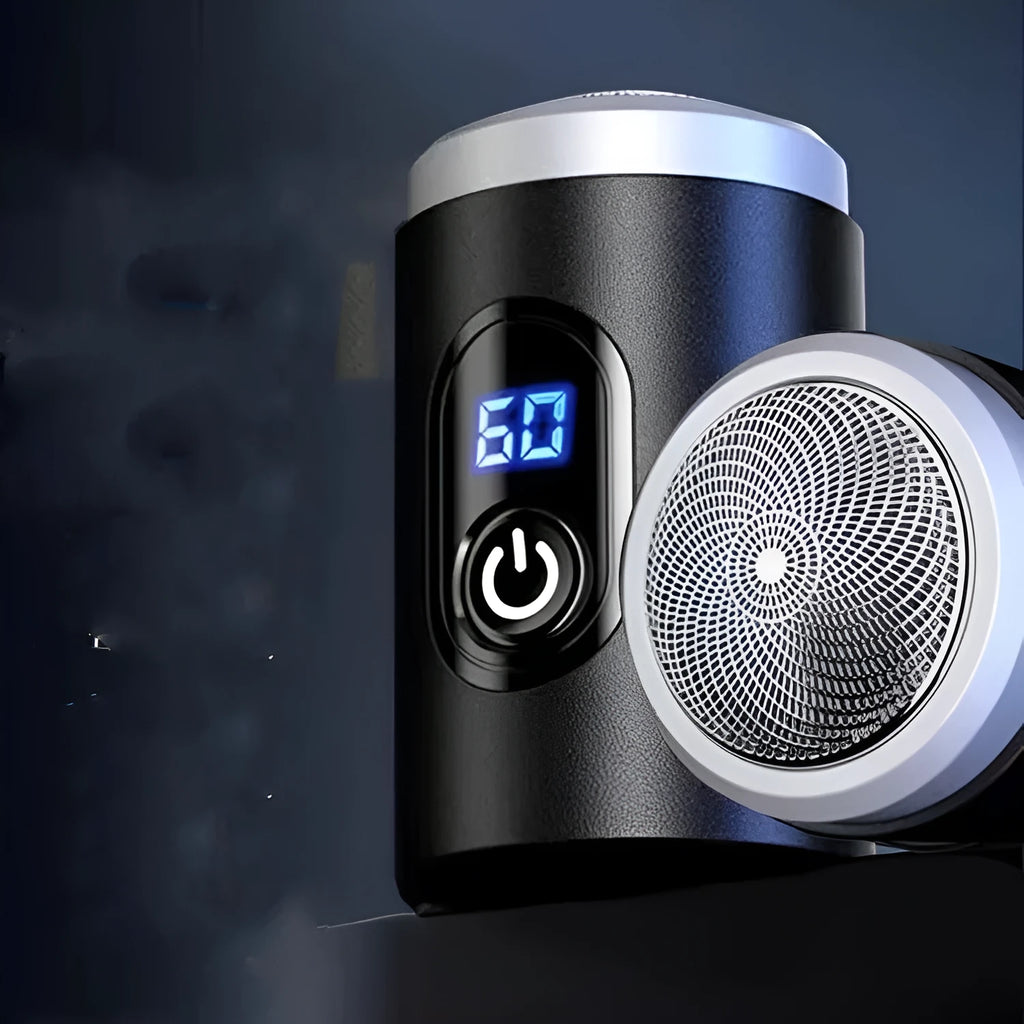 Black mini USB rechargeable electric shaver with cleaning brush and charging cable on a white background.