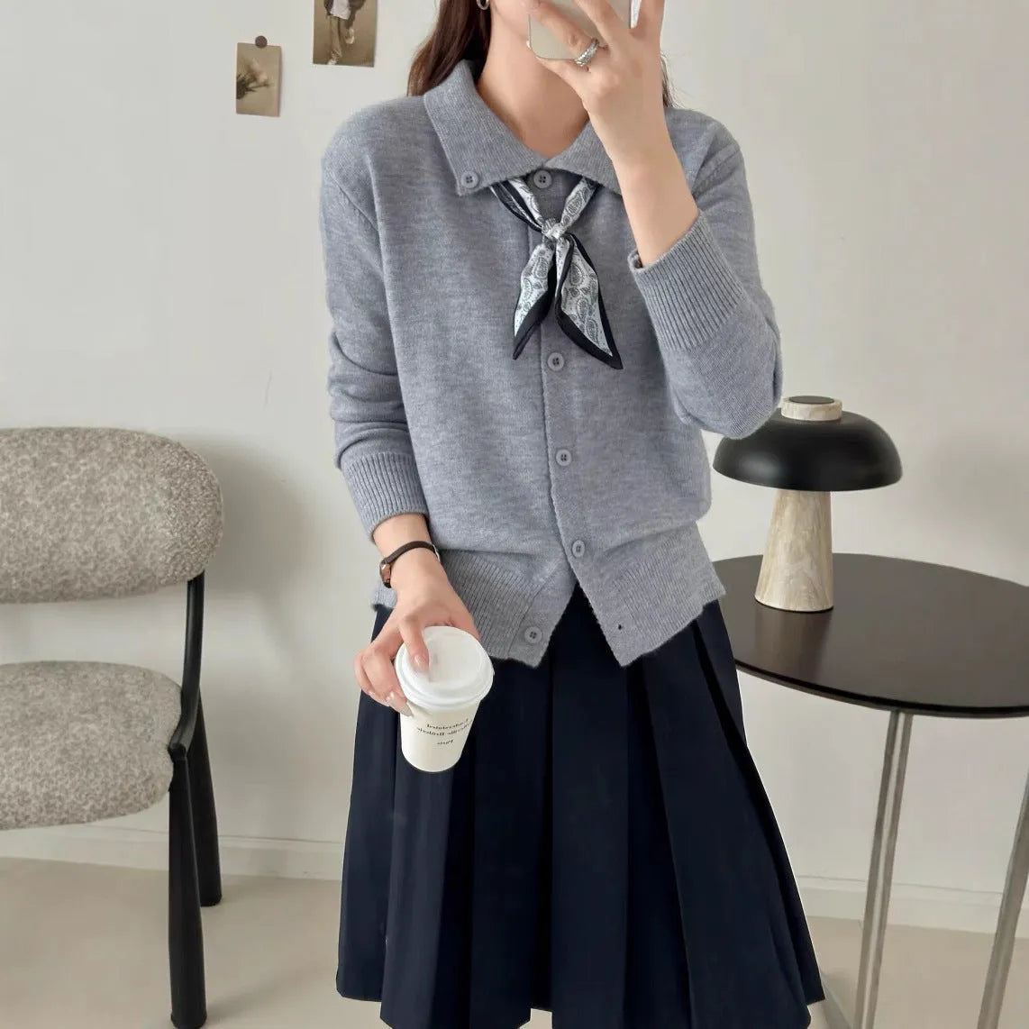 Lapel scarf sweater cardigan in acrylic knit, shown in milky white with splicing detail and long sleeves.