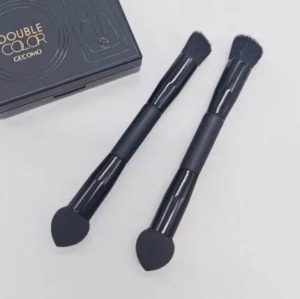 Double-headed concealer brush with black wooden handle, artificial fibre bristles, and angled sponge tip.