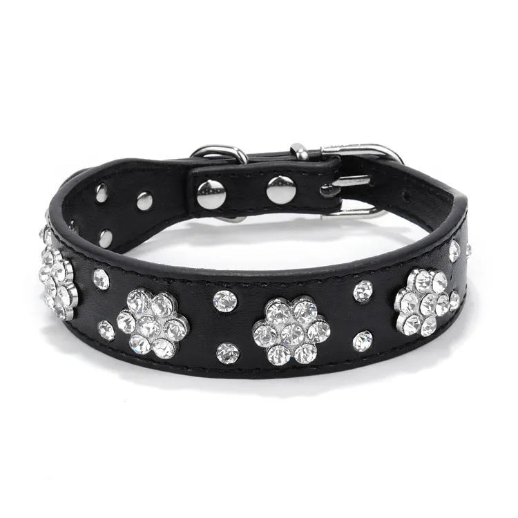 Black PU leather dog collar with rhinestone flower pattern and studs, adjustable for small dogs.